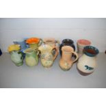 Mixed Lot: Various assorted decorated jugs to include Myott, Arthur Wood and others