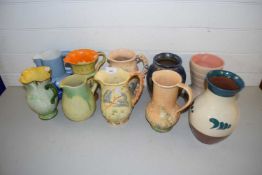 Mixed Lot: Various assorted decorated jugs to include Myott, Arthur Wood and others