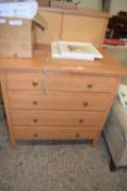 Modern light wood four drawer bedroom chest