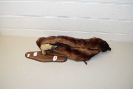 Deers foot coat hook together with a mink collar