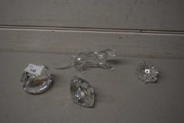 Swarovski crystal models, hedgehog, swan, clam shell, and a leopard together with original boxes (