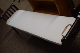 Modern dark wood long stool or window seat with loose cushion