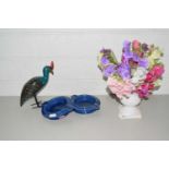 Mixed Lot: A vase of artificial Sweetpea flowers together with two ashtrays and a further bird