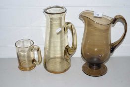 Mixed Lot: Smoked glass jugs and tankard