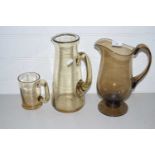 Mixed Lot: Smoked glass jugs and tankard