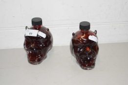 Two small devils head shaped bottles marked MGF