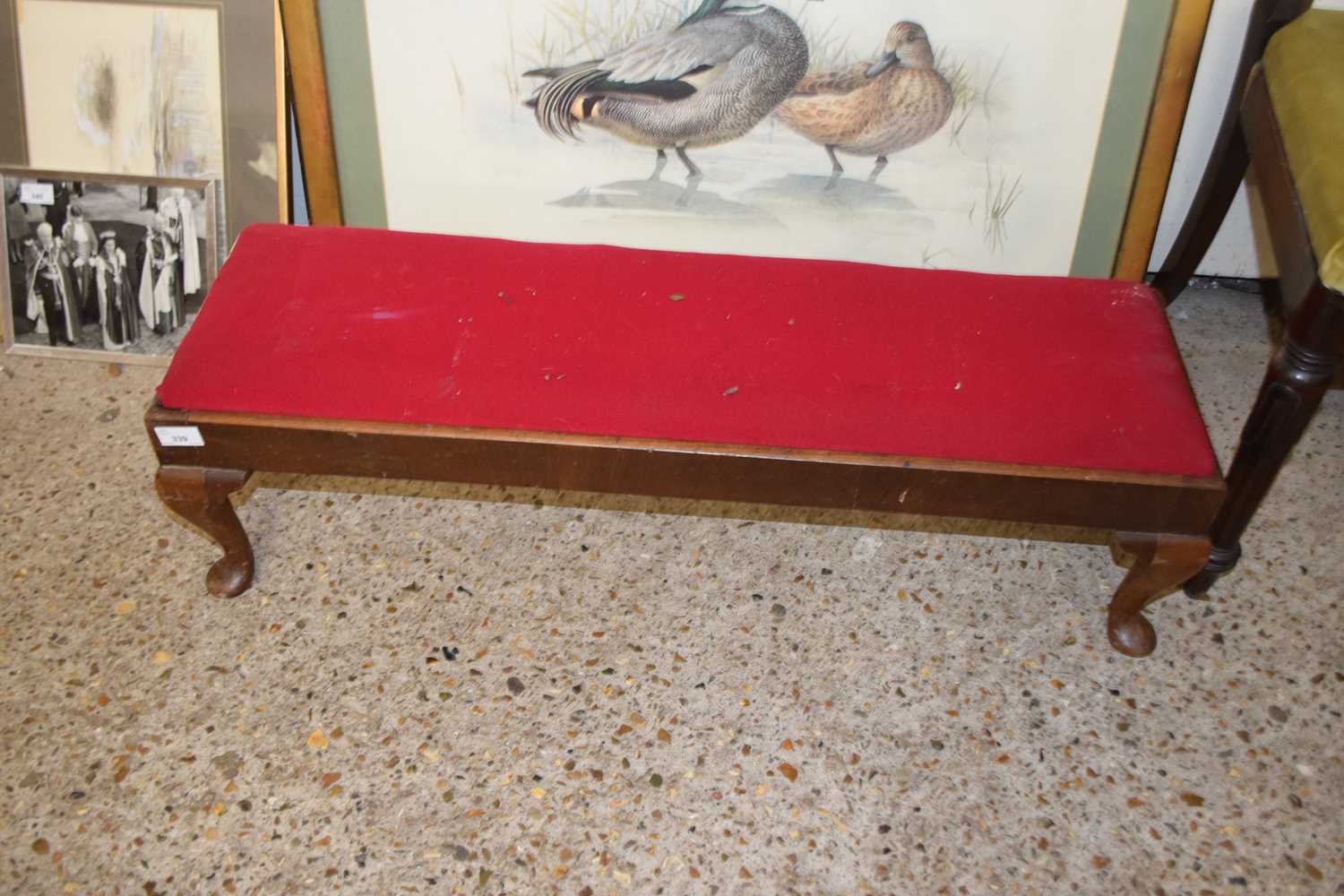 Red upholstered footstool