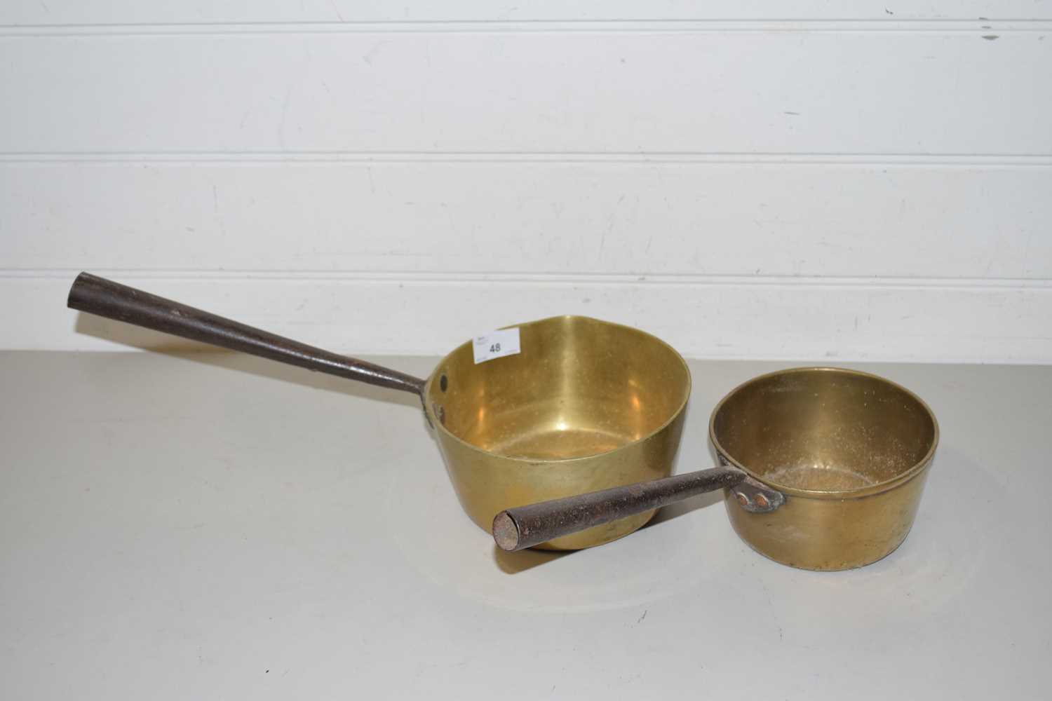 Two vintage brass saucepans