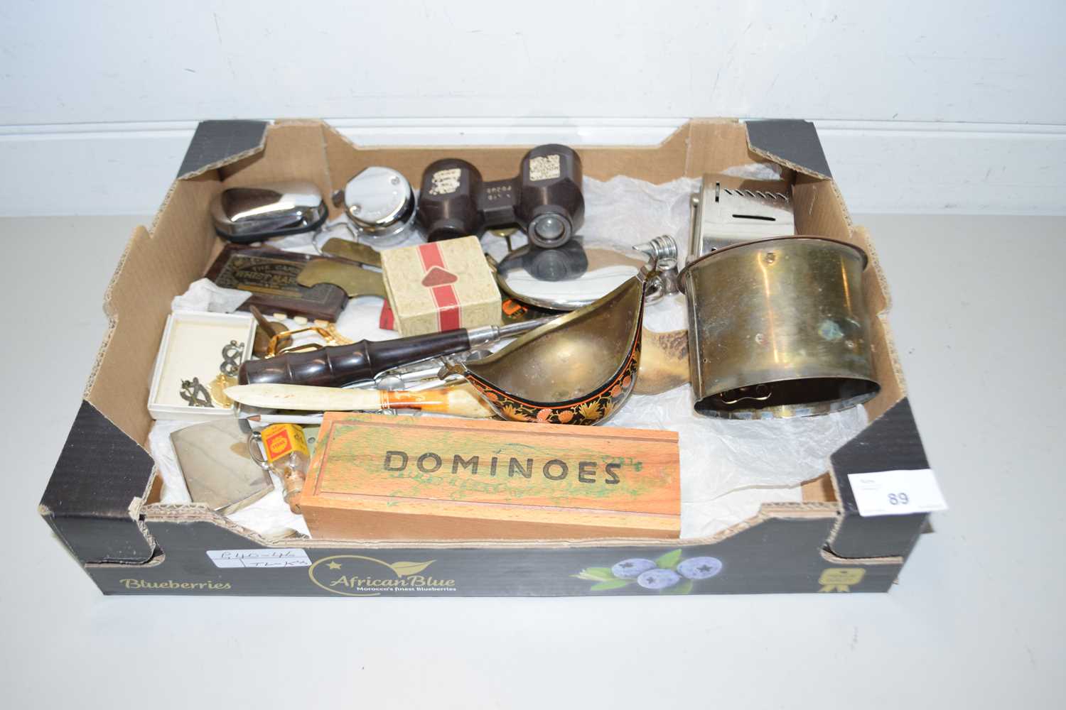 Box of mixed items to include clock movement, pewter hip flasks, Barclays Bank home safe money box