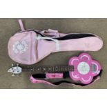 Discontinued pink flower Daisy Rock 4 string bass guitar with gig bag and pink fluffy strap.