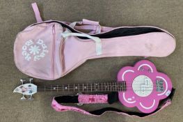 Discontinued pink flower Daisy Rock 4 string bass guitar with gig bag and pink fluffy strap.