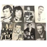 A large quantity of black and white postcards depictibg 1960s rock 'n' roll stars (many duplicates),