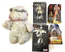 A mixed lot of Star Wars collectible figurines and toys to include: - A plush toy of Ewok '