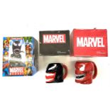 A mixed lot of boxed Marvel collectibles to include: - A Venom bobble-head - A Venom moulded mug - A