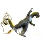 A vintage 1980s Dor Mei (China) articulated plastic figurine of Godzilla, repurposed as a lamp base.