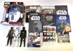 A large mixed lot of modern Star Wars merchandise to include: - A boxed R2-D2 3D Battery powered