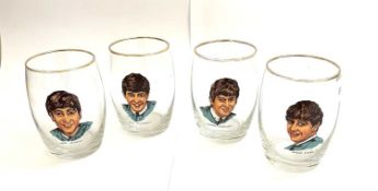 A set of 4 vintage glass tumblers depicting The Fab Four - John, Paul, George and Ringo. Beatles