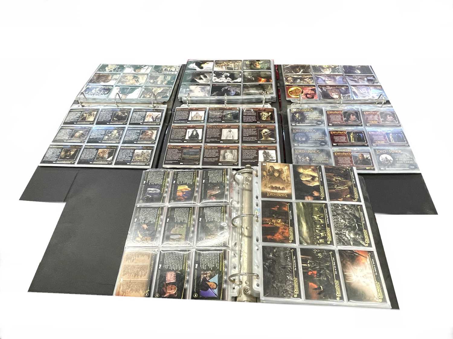 Mixed lot of folios containing a large quantity of Topps Lord of the Rings collectible cards.