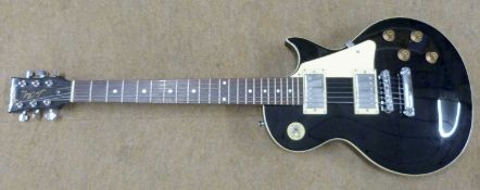 A modern electric guitar, a reproduction of a Les Paul. The headstock/neck by John Hornby Skewes,