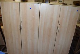 Pair of light wood finish two door office cupboards