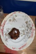 Two meat plates and a sash window stay