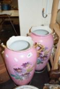 Pair of large late 19th Century pink and floral decorated vases