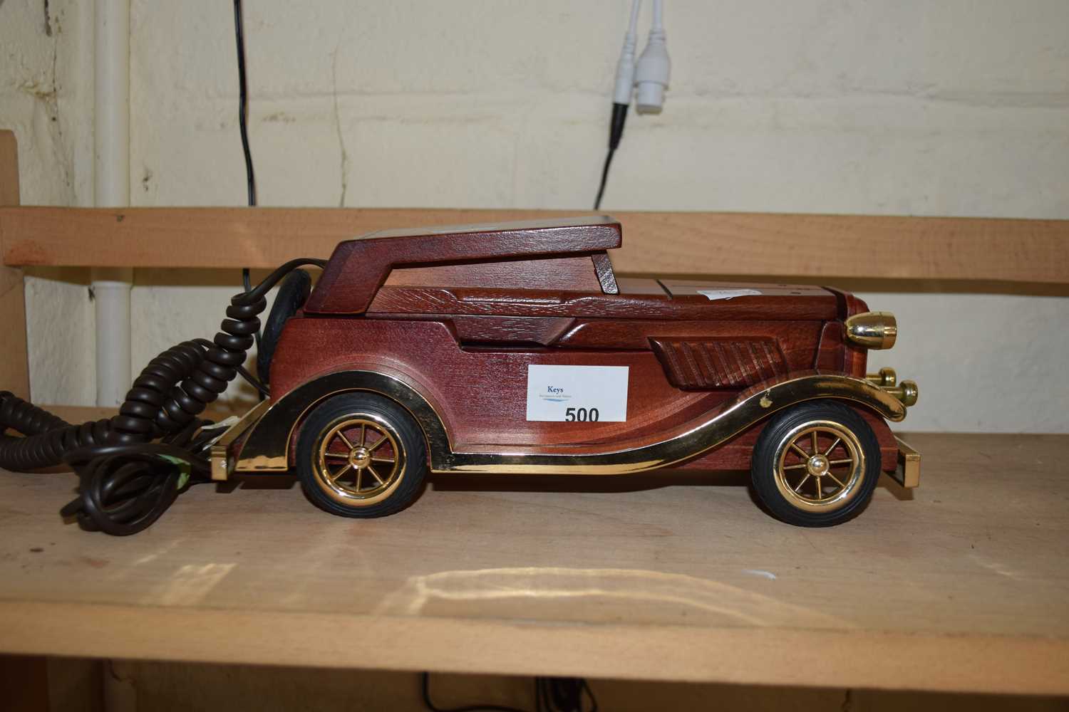 Novelty telephone formed as a vintage car