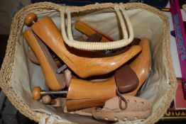 Basket of various assorted shoe stretchers