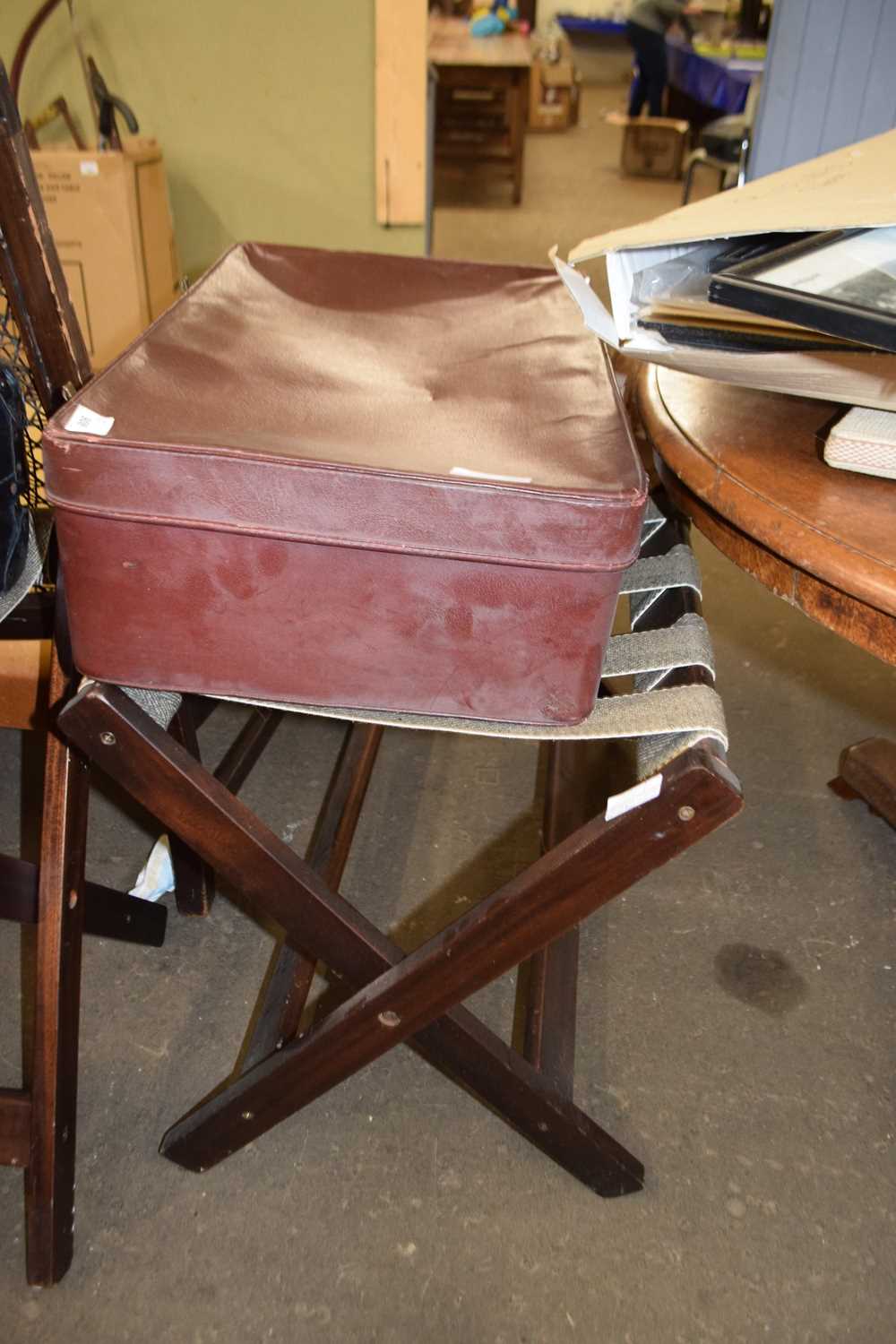 Vintage suitcase with folding wooden stand