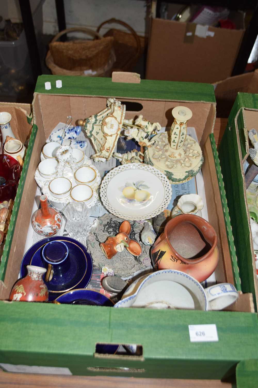 Box of mixed items to include an egg cruet, carousel ornament and others