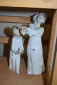 Two Lladro figures of a girl and a boy