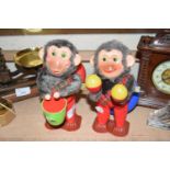 Two clockwork toy monkey's