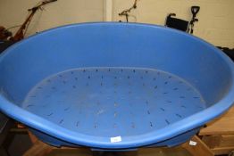 Large blue plastic dog bed