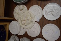 Collection of 20th Century plaster work wall plaques decorated with classical figures