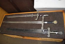 Three reproduction swords