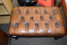 Brown leather upholstered footstool