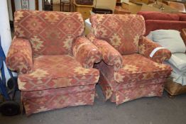 Pair of red upholstered armchairs