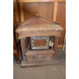 20th Century mantel clock set in a large oak architectural mount