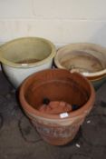 Three various assorted terracotta and glazed plant pots