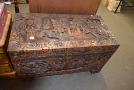 Heavily carved 20th Century Chinese camphor wood chest, 105cm wide