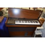 Yamaha CN-1000 keyboard and a leather case of assorted sheet music