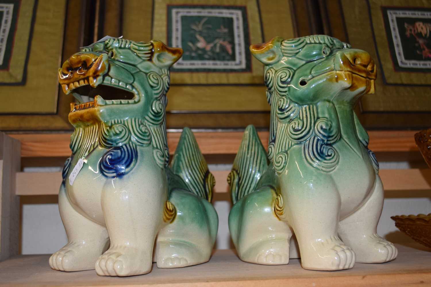 Pair of modern Chinese Foo dogs and various pressed amber glass items