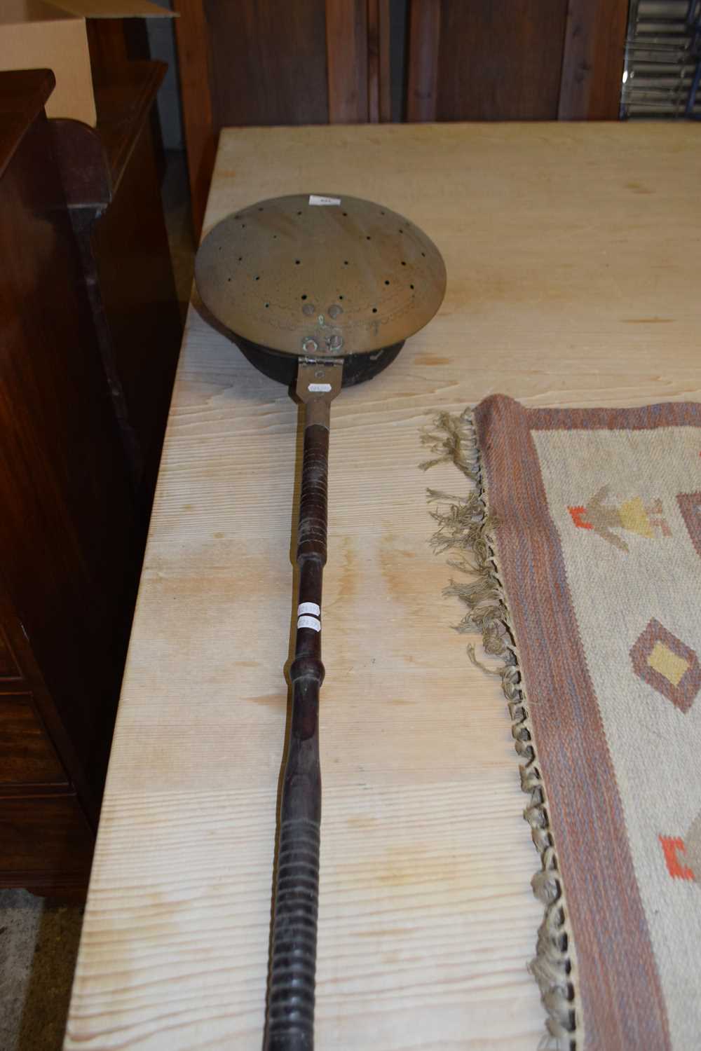 Vintage bed warming pan on turned handle
