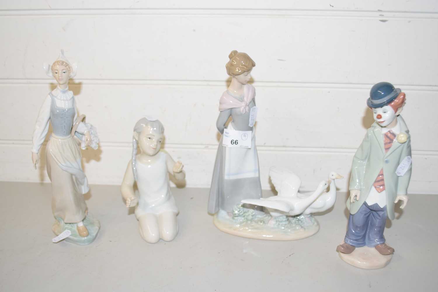 Mixed Lot: Lladro model of a clown, Lladro model of a lady with geese, further Lladro of a lady with
