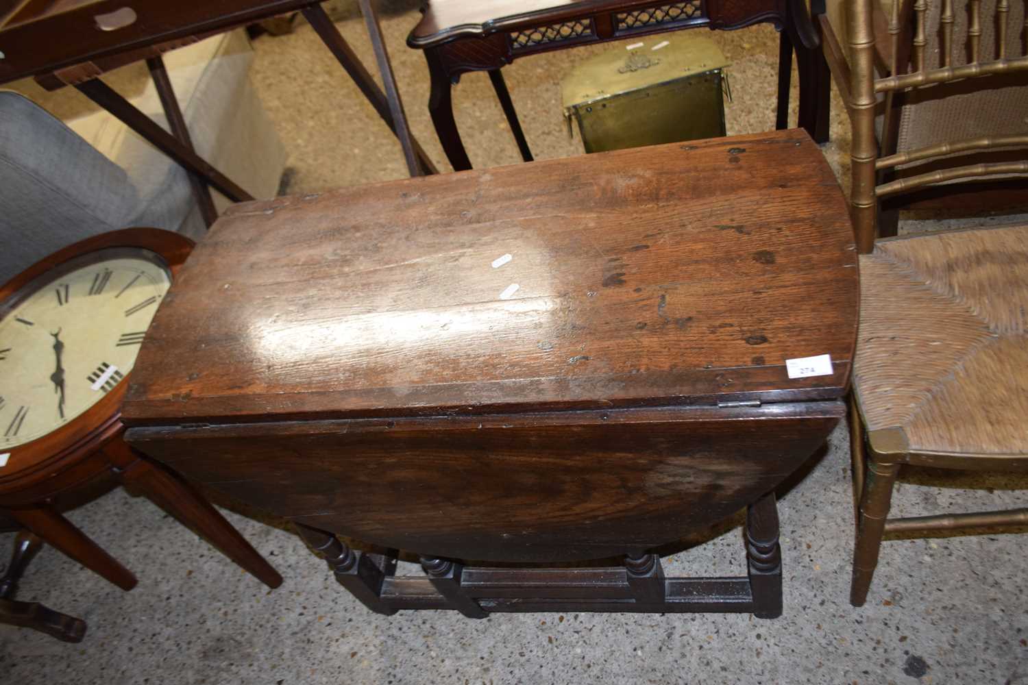 18th Century oval oak drop leaf dining table on turned legs