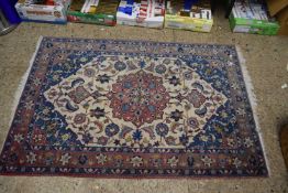 20th Century Middle Eastern wool floor rug decorated with a large central floral panel