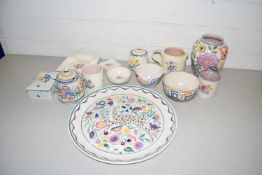 Collection of Poole pottery items to include a plate decorated with a deer, various small vases,