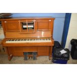 Steck pianola piano together with two boxes of accompanying rolls, overall width 143cm