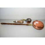 Copper bed warming pan, copper graduated set of miniature saucepans and a copper powder flask