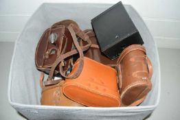 Box of various cases for binoculars, vintage cameras and other items